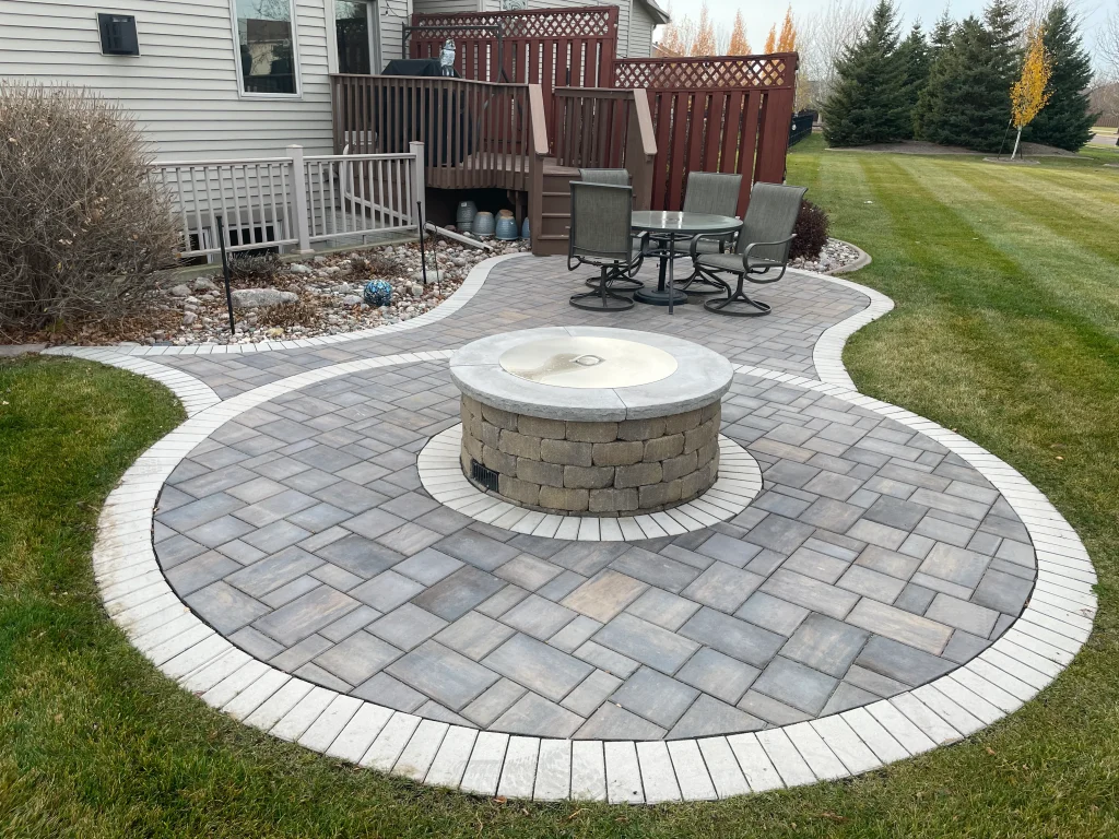 IMG_1606 Outdoor stone patio with firepit.