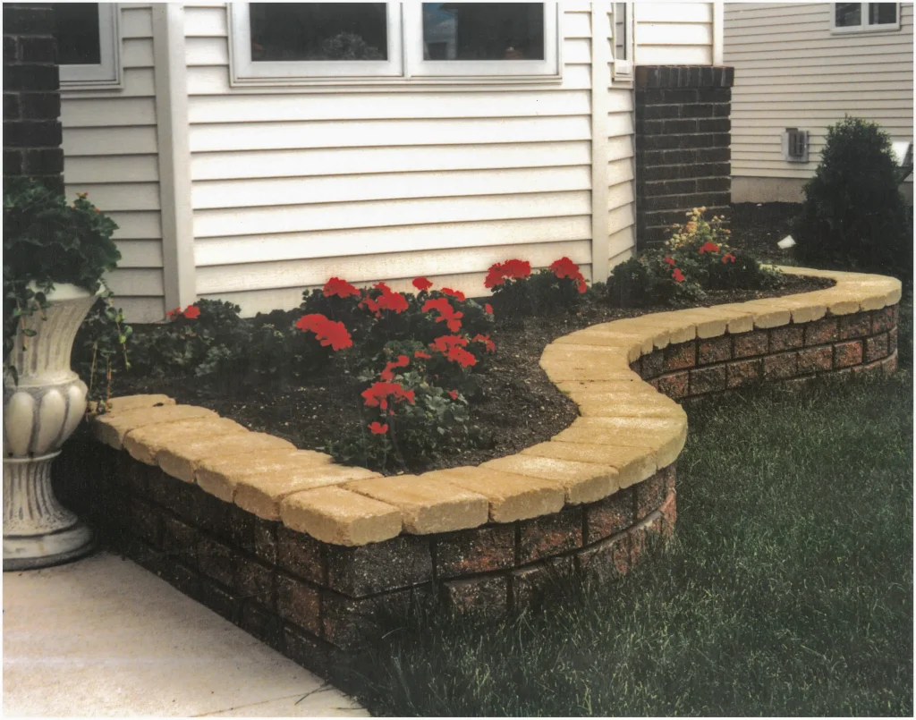 SKM_C451i24121116390 Outdoor brick ledge for plants.
