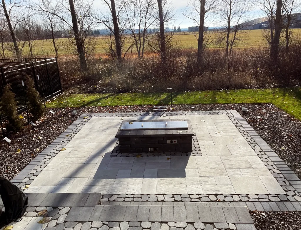 IMG_1594-scaled-2 Outdoor stone patio with firepit.