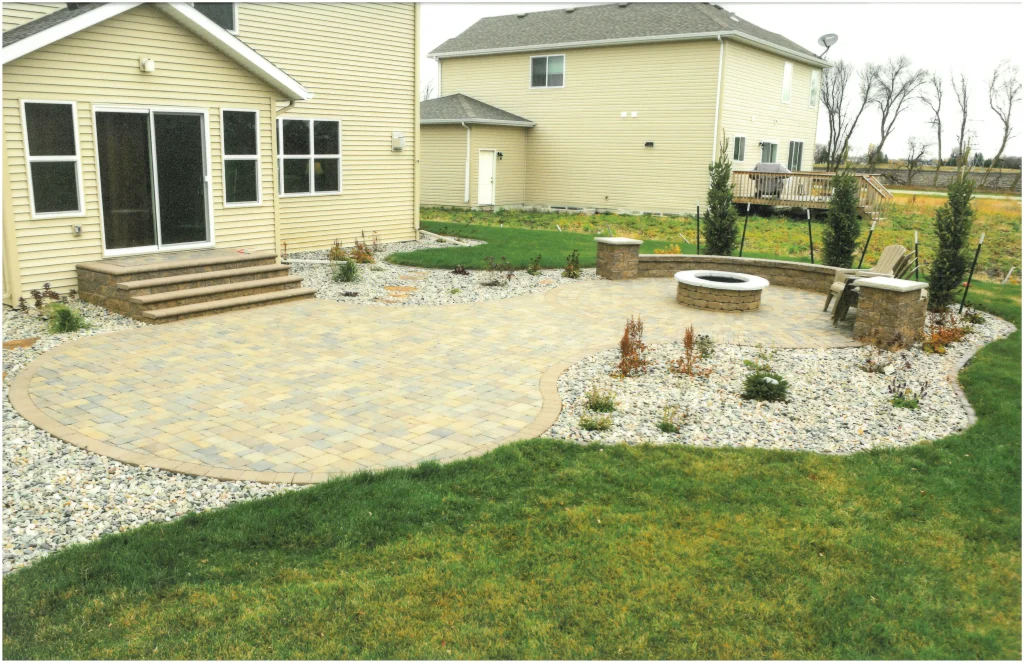 SKM_C451i24121716050_EDIT Brick backyard patio with firepit, ledge, and columns.