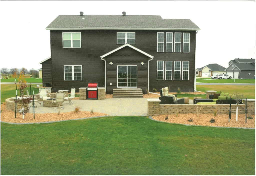 SKM_C451i24121716400_EDIT Brick patio with brick ledges, columns, and a firepit.